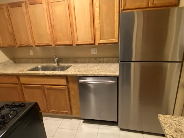 18539 Windy Knoll Way, Houston, TX 77084 - kitchen with stainless steel appliances, light tile patterned floors, and light stone countertops