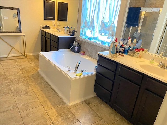 bathroom with vanity and a tub to relax in