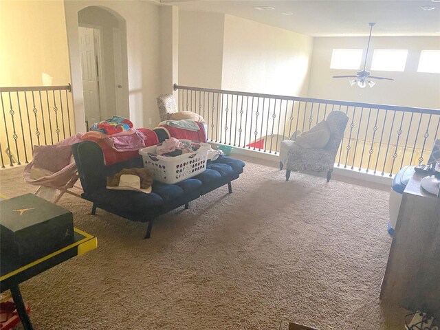 18539 Windy Knoll Way, Houston, TX 77084 - sitting room featuring ceiling fan, carpet, and arched walkways