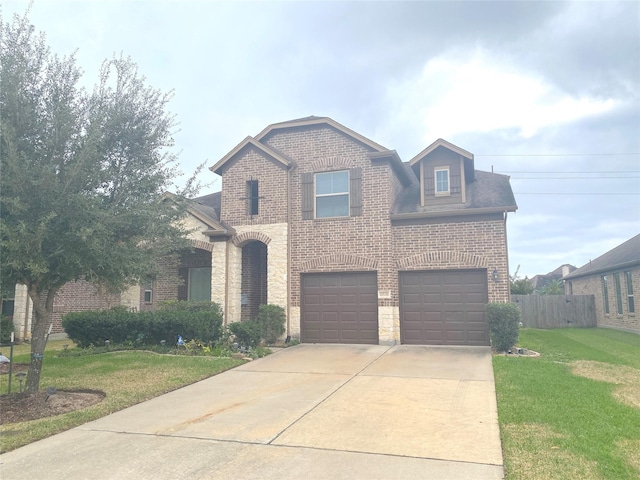 view of front of house featuring a garage and a front lawn