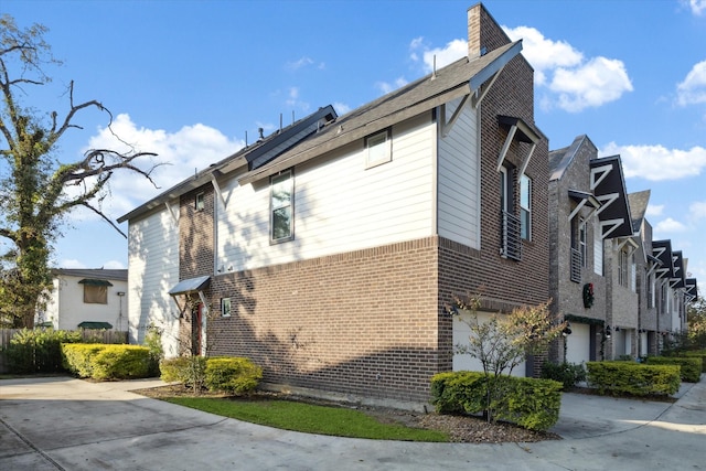 view of side of home featuring a garage