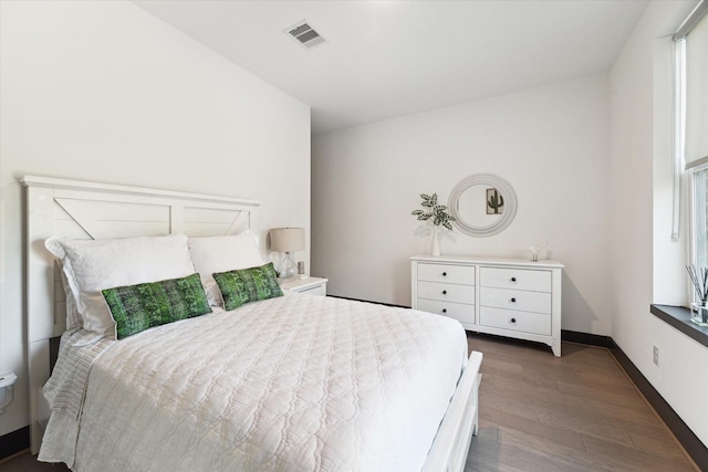 bedroom featuring dark wood-type flooring