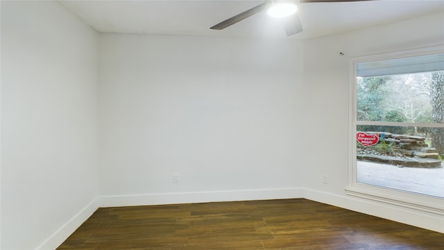 empty room featuring dark hardwood / wood-style floors, ceiling fan, and plenty of natural light