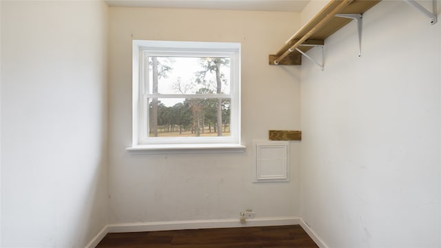 laundry room with dark wood-type flooring