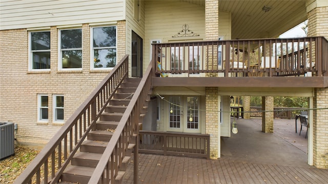 exterior space featuring stairs, a patio area, and cooling unit