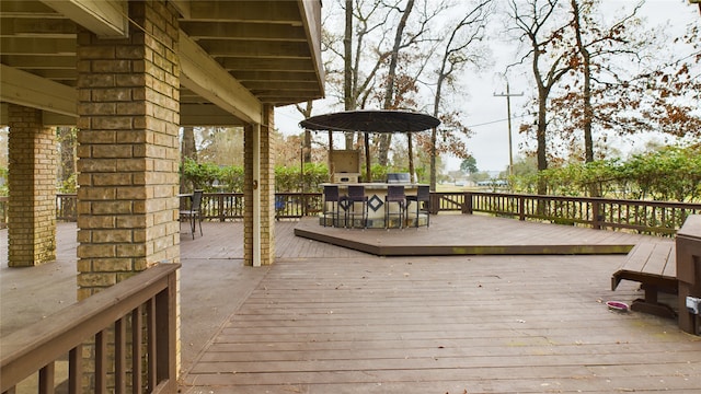 wooden deck featuring exterior kitchen