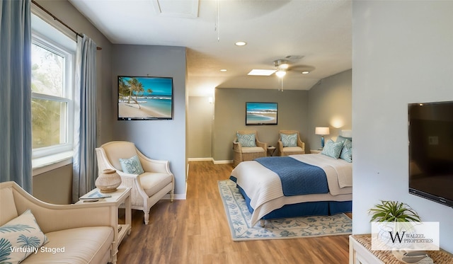 bedroom with baseboards, ceiling fan, recessed lighting, attic access, and wood finished floors
