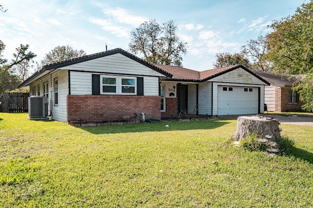 ranch-style home featuring cooling unit, a garage, and a front lawn