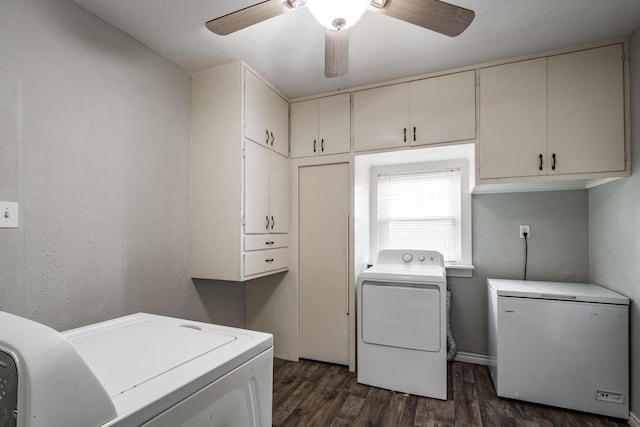 washroom with washing machine and clothes dryer, ceiling fan, dark hardwood / wood-style flooring, and cabinets