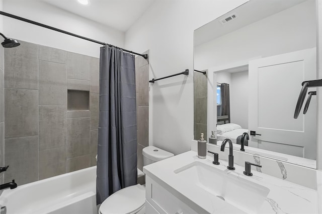 full bathroom featuring shower / bath combination with curtain, toilet, and vanity