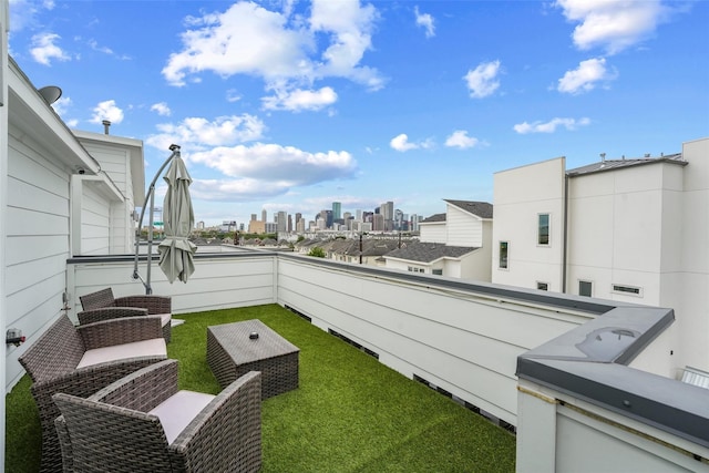 view of patio featuring a balcony