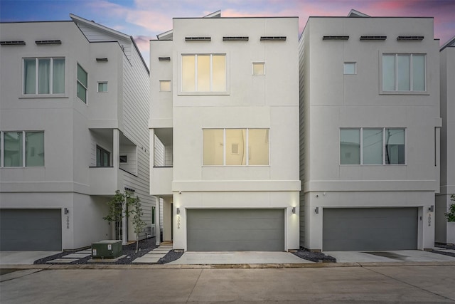 exterior space featuring cooling unit and a garage