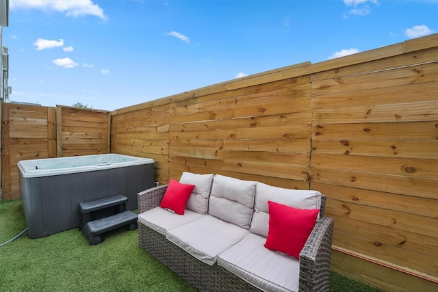 view of patio with an outdoor hangout area and a hot tub