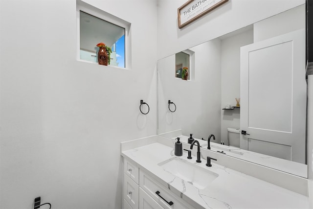 bathroom with vanity and toilet