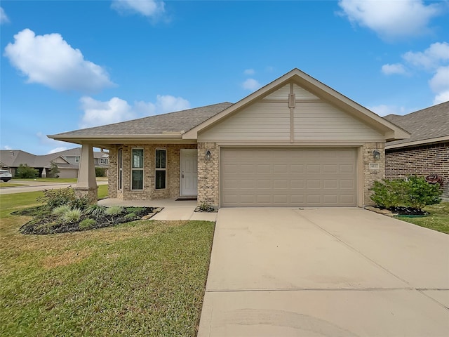 view of front of house with a garage and a front yard