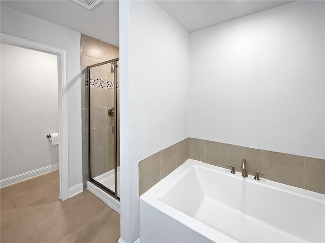 bathroom with separate shower and tub