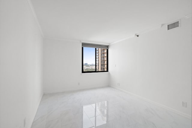 unfurnished room featuring crown molding