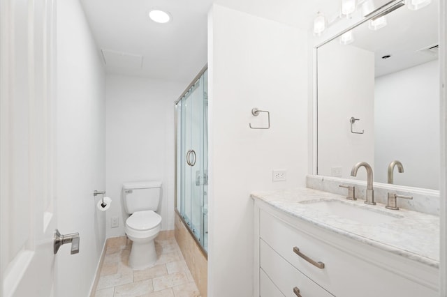 bathroom with vanity, toilet, and an enclosed shower