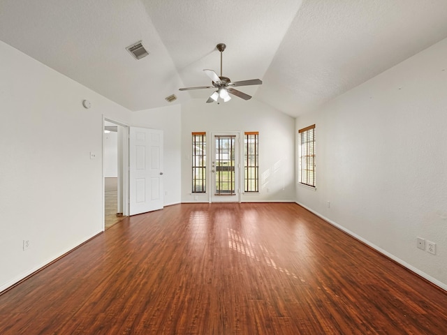 unfurnished room with a textured ceiling, lofted ceiling, ceiling fan, and dark hardwood / wood-style floors