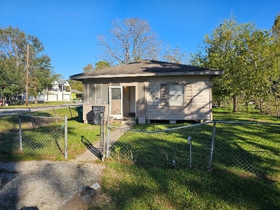 view of outbuilding with a lawn