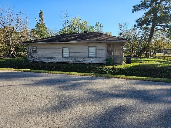 view of property exterior featuring a yard