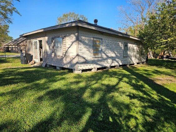 view of home's exterior featuring a lawn