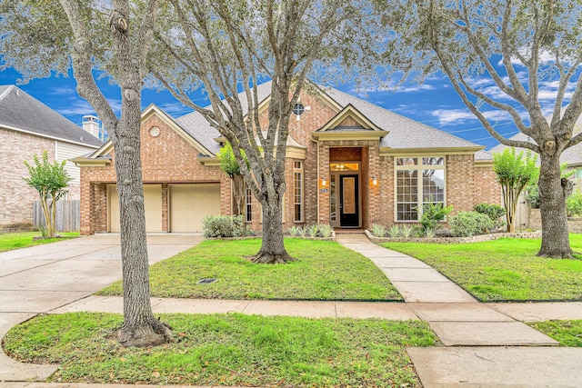 view of front of property with a garage and a front yard