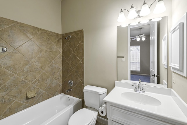 full bathroom featuring vanity, ceiling fan, toilet, and tiled shower / bath combo