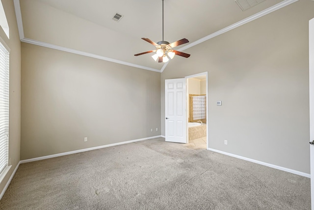 spare room featuring ornamental molding, carpet floors, ceiling fan, and lofted ceiling