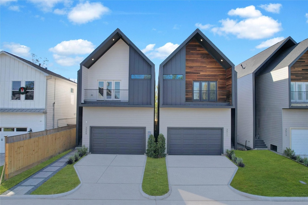 view of front of home featuring a balcony, a garage, and a front lawn