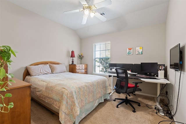 bedroom with ceiling fan, light colored carpet, and vaulted ceiling