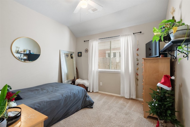 carpeted bedroom featuring vaulted ceiling and ceiling fan