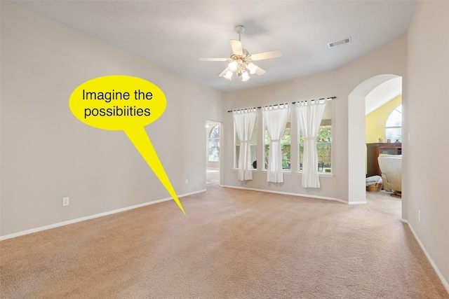 carpeted empty room featuring ceiling fan