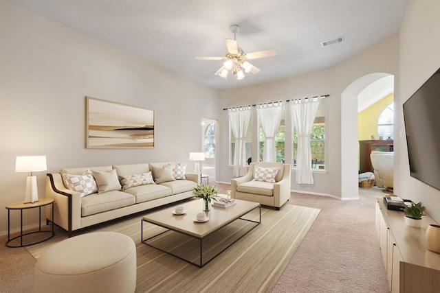 carpeted living room featuring ceiling fan