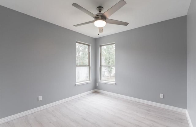 unfurnished room featuring light wood-type flooring and ceiling fan