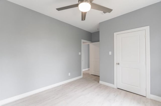 unfurnished bedroom featuring ceiling fan and light wood-type flooring