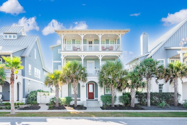 view of front of home featuring a balcony