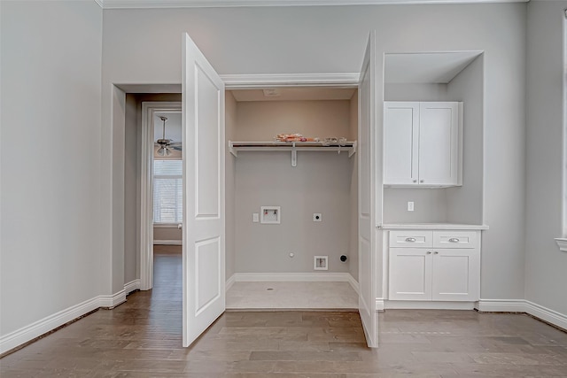 laundry room featuring hookup for an electric dryer, washer hookup, light hardwood / wood-style floors, and hookup for a gas dryer