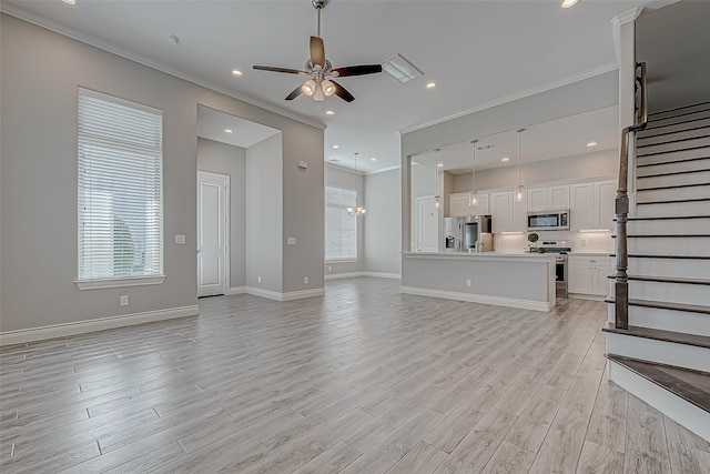 unfurnished living room with ceiling fan, light wood-type flooring, and ornamental molding