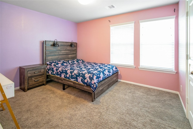 bedroom featuring light carpet