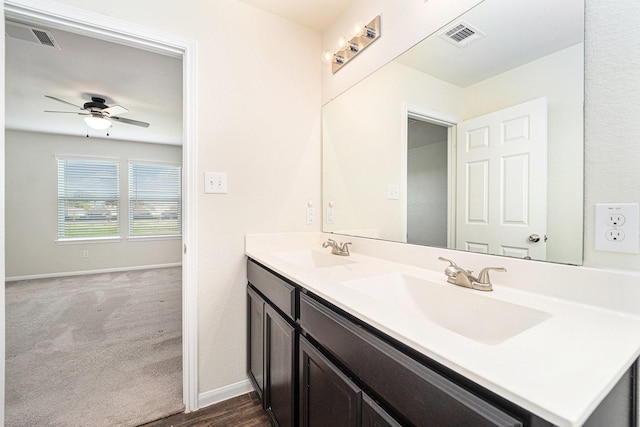 bathroom with ceiling fan and vanity