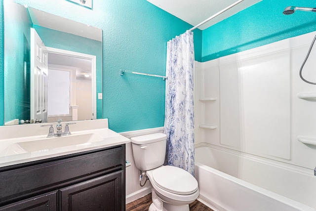 full bathroom featuring hardwood / wood-style flooring, toilet, vanity, and shower / tub combo