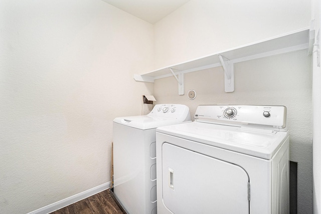 laundry room with dark hardwood / wood-style floors and independent washer and dryer