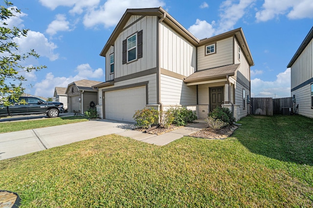 view of front of home with a front yard and a garage