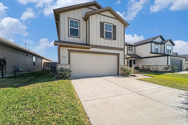 view of front of home with a front lawn and a garage