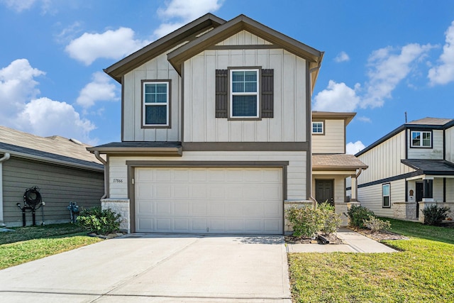 view of front of home featuring a front yard and a garage