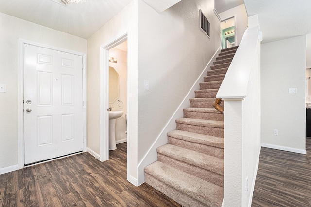 foyer entrance with dark hardwood / wood-style flooring