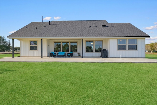 rear view of property with a lawn, outdoor lounge area, and a patio