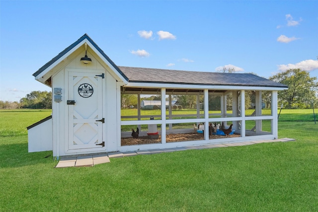 view of outbuilding with a lawn