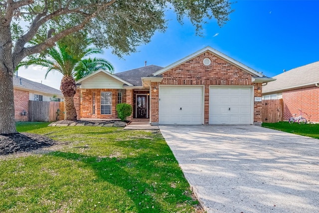 ranch-style home with a garage and a front lawn